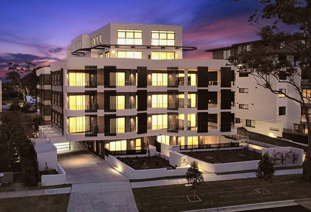 Bluestone apartment development at 8 Lords Avenue, Asquith, lit up at dusk